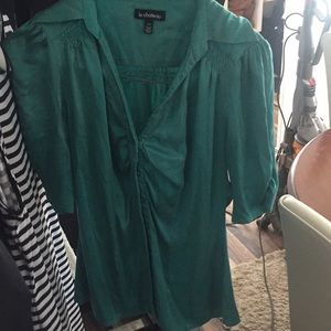 Green quarter inch sleeve satin blouse